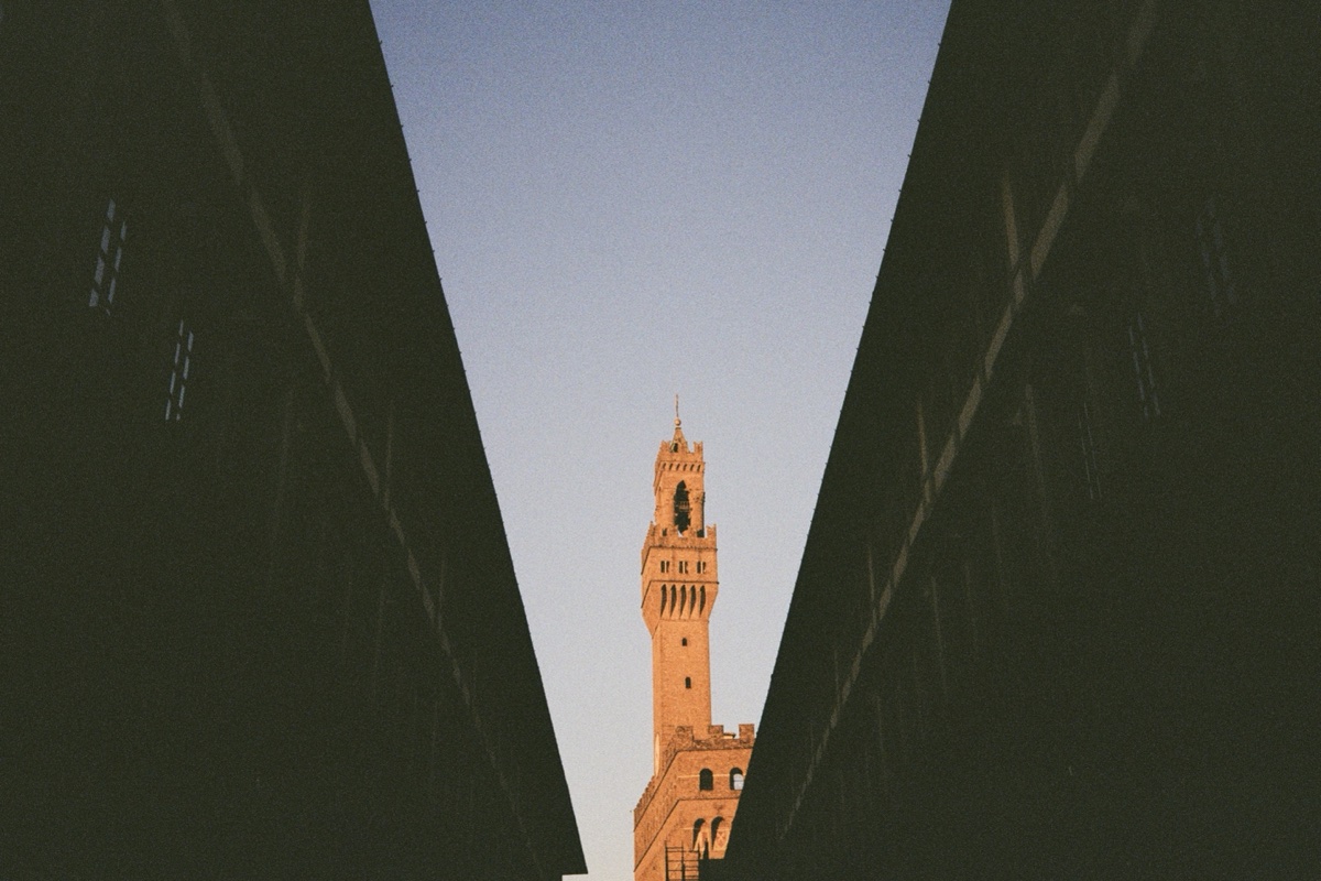 Historic tower framed through architecture in Florence, Italy - Urban photography by Rocco Goldschmidt