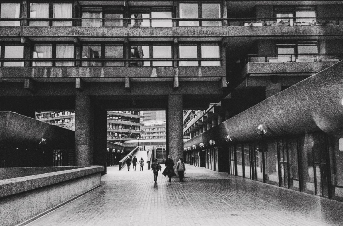 Barbican Estate elevated walkway and concrete pillars in London, United Kingdom - Black and white architecture photography by Rocco Goldschmidt